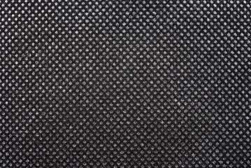 Close-up texture of natural weave cloth in dark and black color. Fabric texture of natural cotton or linen textile material. Seamless background