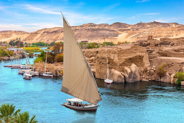 Nile River scenery with famous sailboats, Aswan, Egypt