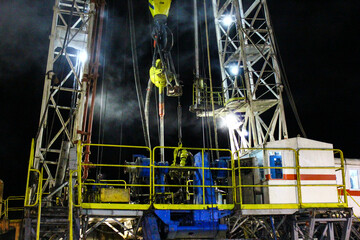 Oil rig installed for access to geothermal resources. photo taken at night