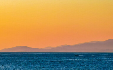 Mountains and cliffs by the sea for sunset in Mexico.