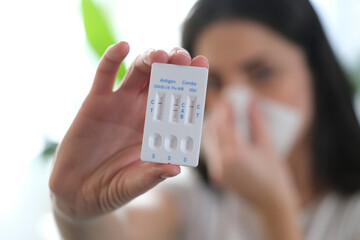 A woman is sick, a combo antigen test (covid-19, flu a b, RSV) is needed for proper diagnosis.
