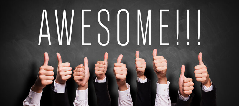 many business hands with thumbs up gesture in front of a blackboard with the word AWESOME!!!