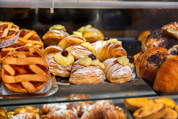 Neapolitan bakers preparing famous Italian pastries in a traditional bakery in Naples, Italy