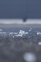  closeup of broken glass lying on the street