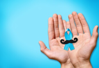 Prostate Cancer concept, hand holding Blue Ribbon