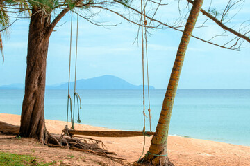 A swing by calm coastal scenery in Kijal, Kemaman, Terengganu, Malaysia.