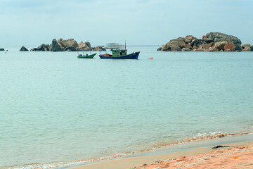 Fototapeta na wymiar Fishing boats at the sea in Kijal, Kemaman, Terengganu, Malaysia.