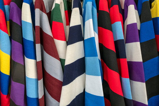 Abstract image of colourful striped University College rugby shirts for use as aa background texture
