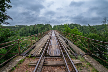 Fototapeta na wymiar Landscape with an old railway bridge.