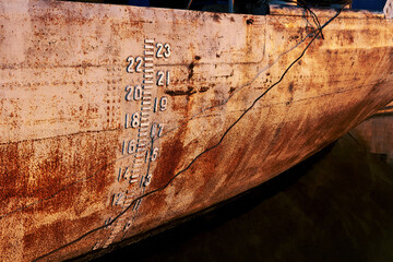 Draft mark of grungy old cargo ship or vessel