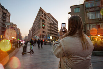 Woman taking pictures of a scenic landscape in Yerevan city