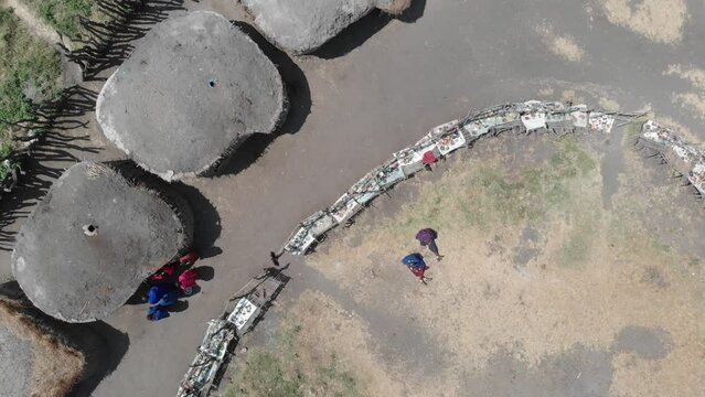 Masai Mara african tribe village in the Serengeti National Park by drone, Tanzania, East-Africa.