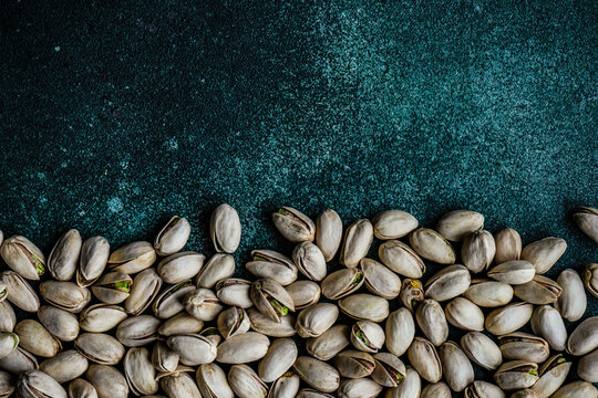 Overhead view of roasted pistachio nuts in shells