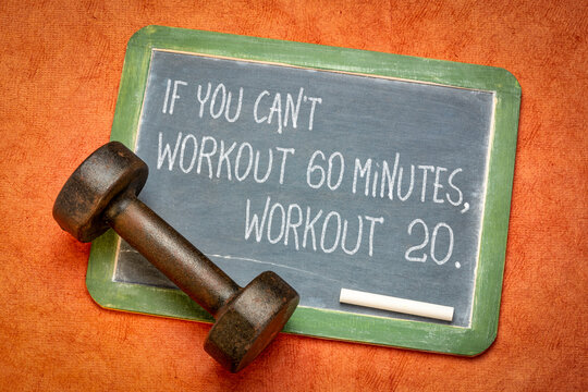 if you can not workout 60 minutes, workout 20. Inspirational fitness advice on a blackboard with a dumbbell