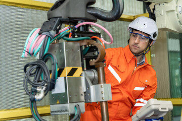 Fototapeta premium Team of engineers practicing maintenance Taking care and practicing maintenance of machines in the factory so that they can be used continuously.
