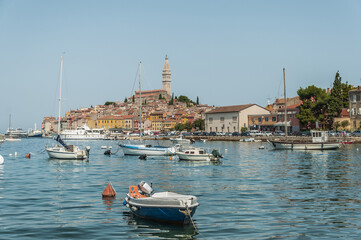 Obraz premium View to Adriatic Sea and old town of Rovinj in Croatia and boats.