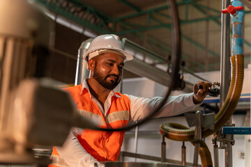 Team of engineers practicing maintenance Taking care and practicing maintenance of machines in the factory so that they can be used continuously.