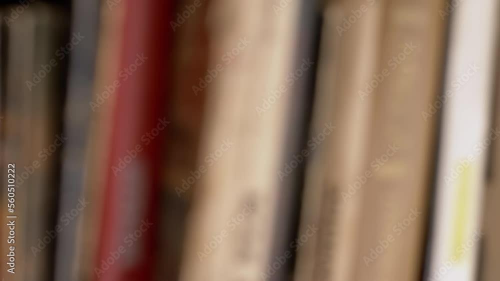Poster blurred background old vintage books stand in a row on a bookshelf in home. books on bookshelves in 