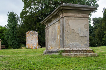 Fototapeta na wymiar Old English tomb grave stone in a church graveyard