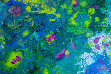 Naklejka na ściany i meble Mixture of liquid acrylic colors creating a marbled texture of bright vibrant colors ideal for backgrounds and graphic design