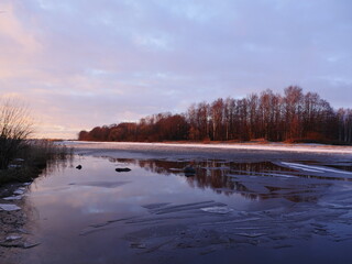Fototapeta na wymiar river ice evening winter landscape, golden hour