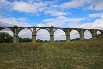Fototapeta premium View of the abandoned old Mokrinsky railway bridge. Russia, the village of Mokry, the bridge was built in 1918
