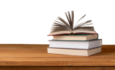 Old open books on a wooden deck