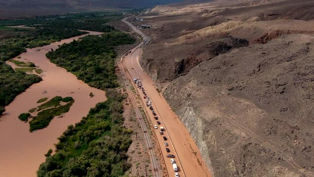Aerial zoom out view of brown mudflow