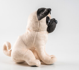 Soft children's toy dog on a white background.