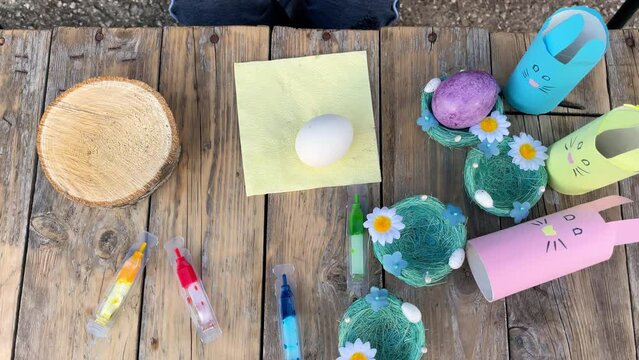 The day before Easter, close-up of children's hands painting eggs