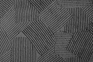 grey background, grey wall and grey decorative plaster in the photo