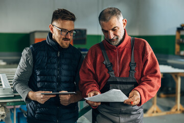 Two workers share the job assignments