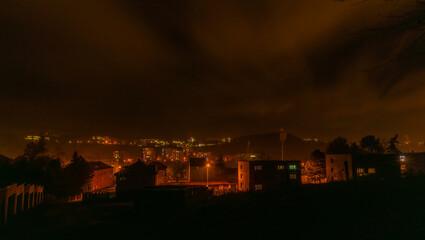 Dark winter cold nigh with orange color lights in Usti nad Labem ciity