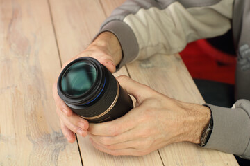 a person holding a macro lens