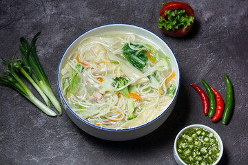 Wonthon Noodles Soup wonton served in bowl isolated on grey background top view of indian and bangladesh food
