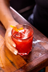 drink in glass on wooden table