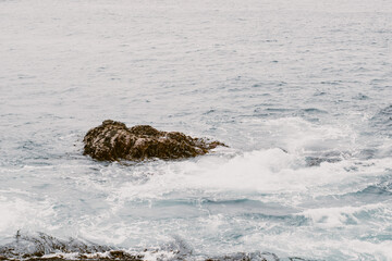 waves crashing on rocks
