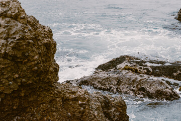 waves crashing on rocks