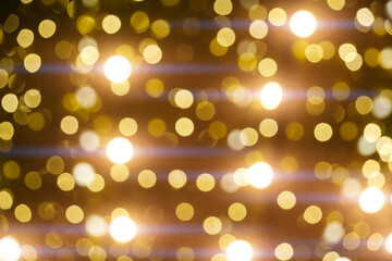 Abstract bright background, bokeh of burning yellow light bulbs.