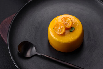 Delicious fresh tartlet with citrus filling and decorated with passion fruit - obrazy, fototapety, plakaty