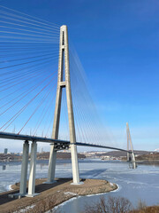Russia, Vladivostok. Bridge to Russian Island in sunny winter day