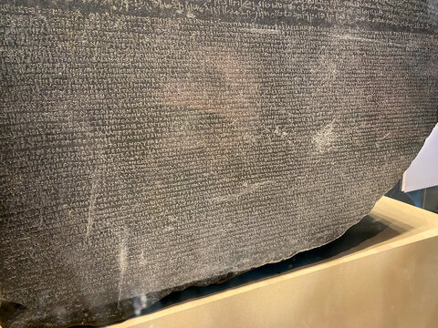 The British Museum. The Rosetta Stone, key to the decipherment of Egyptian hieroglyphs. Decree in Ancient Egyptian using hieroglyphic and Demotic and Ancient Greek.