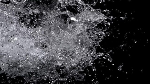Super Slow Motion Shot of Real Side Water Splash Explosion on Black Background at 1000fps.