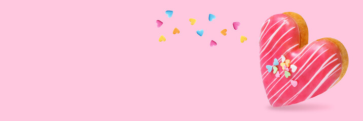 Pink donut in the form of heart on a pink background