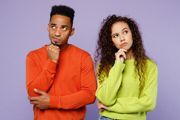 Young sad minded thoughtful couple two friends family man woman of African American ethnicity wear...