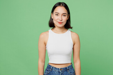 Young smiling cheerful fun happy cool beautiful woman of Asian ethnicity wear white tank shirt...