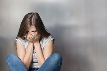 Obraz premium Depression young woman in crisis sitting at home