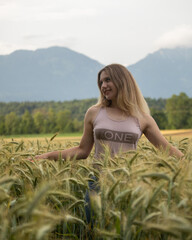 portrait of a woman in a field of wheat