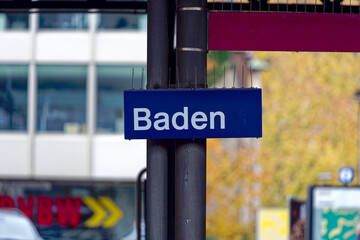 Blue and white sign at railway station at City of Baden, Canton Aargau, on a cloudy gray autumn day. Photo taken November 13th, 2022, Baden, Switzerland.