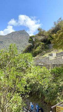 Static vertical video view of the Andes Mountains from Machu Picchu near Cusco Pueblo Peru lost civilization inca peak on blue sky sunny day in 4k